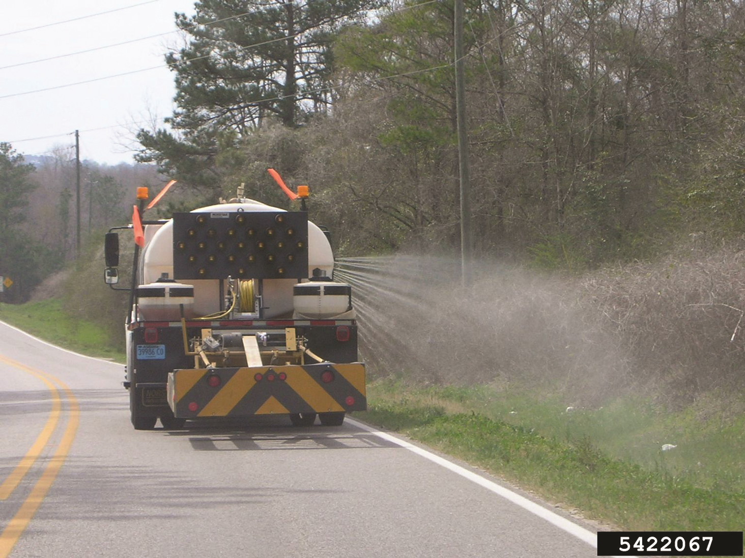 Herbicide sprayed from a truck along the road side