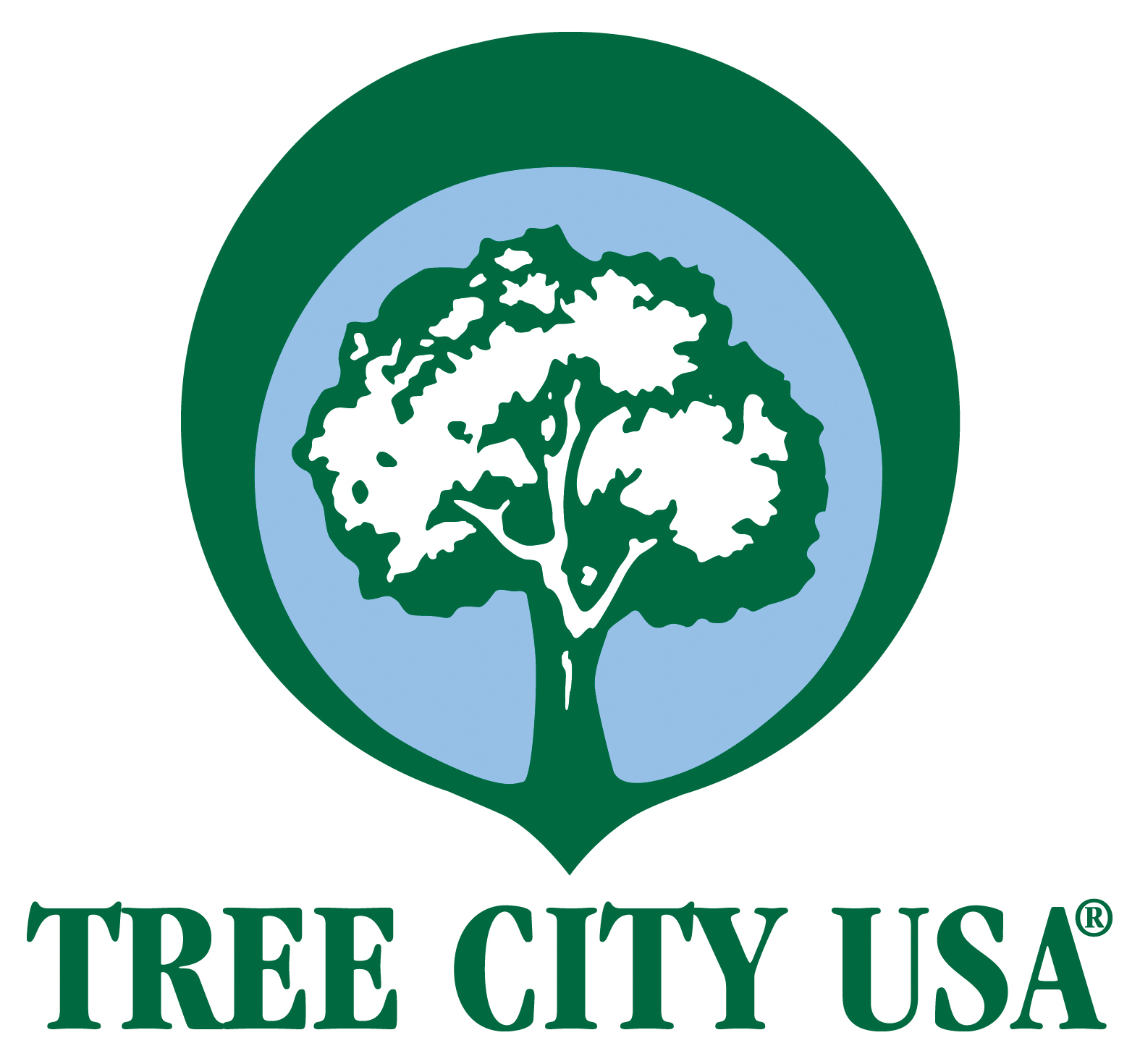 LOGO FOR TREE CITY USA PROGRAM.  GREEN AND BLUE CONCENTRIC CIRCLES WITH A GREEN OUTLINE OF A TREE INSIDE